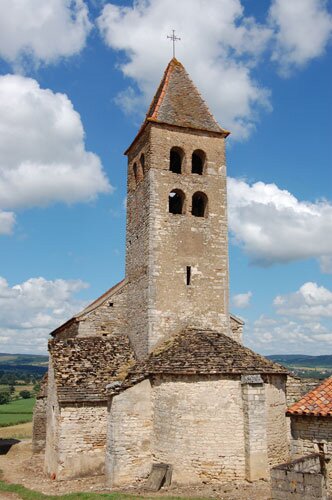 East view photo of the Romanesque church in Colombier-le-Haut.