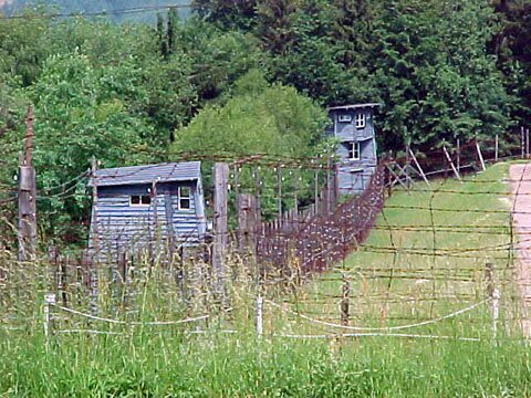 Camp guard towers and barbwire fencing