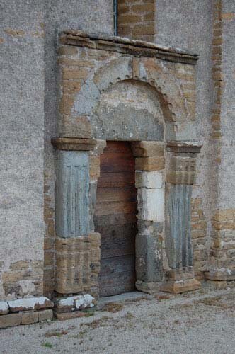 Photo of the Romanesque Church doorway of Saint-Maurice-des-Champs in Burgundy France.