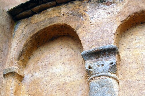 Close-up photo of the arches on the Romanesque Church in the village of Saint Vincent des Pres in Burgundy France.