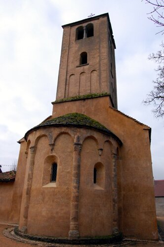 Photo of the apse and the bell tower of the Romanesque Church in the village of Saint Vincent des Pres in Burgundy France.
