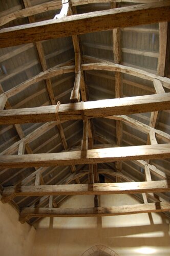 Photo of the roof trusses of the Romanesque church in Saint-Clément-sur-Guye.