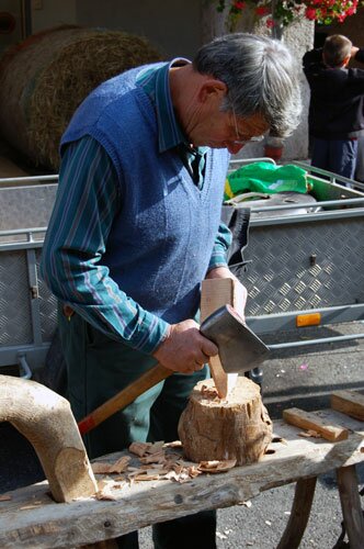Woodcarver in the act of creating a carving during the 2007 Saint Denis Fair.